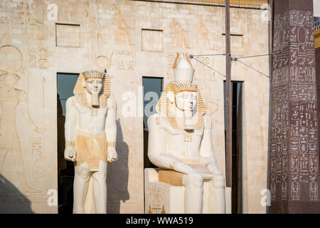 Statues of ancient Egyptian pharaohs and gods. Various hieroglyphs on ...