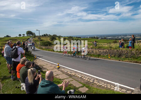The leaders of the hill climb cycle across the top of Werneth Low Country Park during stage eight of the OVO Energy Tour of Britain from Altrincham to Manchester. Stock Photo