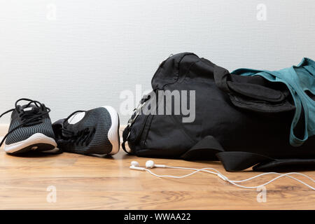 Sports bag with sports equipment. Sportswear and running shoes Stock Photo
