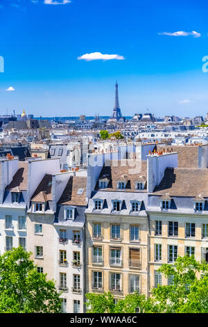 Paris, typical buildings and roofs in the Marais, aerial view from the Pompidou Center, with the Eiffel Tower in background Stock Photo