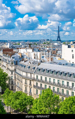 Paris, typical buildings and roofs in the Marais, aerial view from the Pompidou Center, with the Eiffel Tower in background Stock Photo