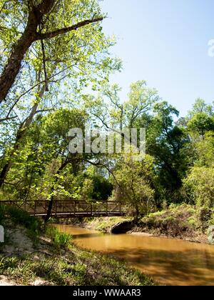 The Woodlands TX USA - 03-26-2019  -  Wooden Bridge Over a Creek 3 Stock Photo