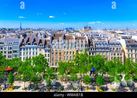 Paris, typical buildings and roofs in the Marais, aerial view from the Pompidou Center, with the Eiffel Tower in background Stock Photo