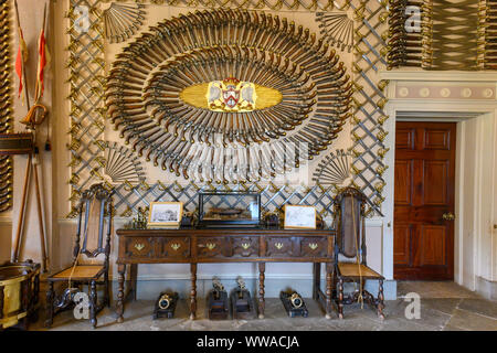 Entrance hall to Culzean Castle Maybole, Carrick, Ayrshire, Scotland, - showing the world famous collection of sidearms. Stock Photo