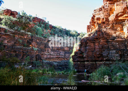 Hiking and swimming in Karijini National-Park, Western Australia with beautiful rock formations Stock Photo