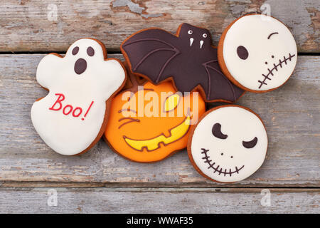 Halloween holiday cookies on wooden background. Stock Photo