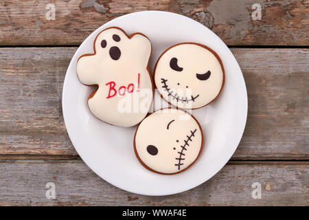 Halloween decorated cookies on plate. Stock Photo
