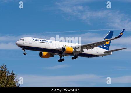 Icelandair Boeing 767 jet airliner plane TF-ISO landing at London Heathrow Airport in Hounslow, London, UK. Space for copy