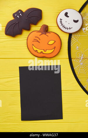 Halloween cookies on yellow background. Stock Photo