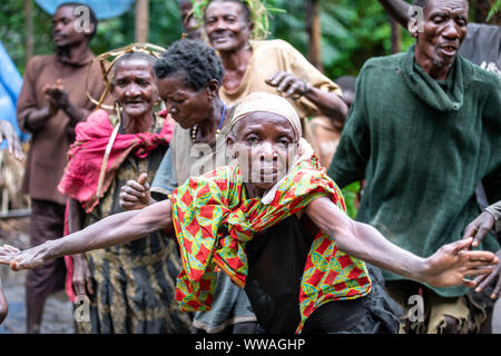 Portrait of pygmy tribeswoman dancing, Uganda Stock Photo