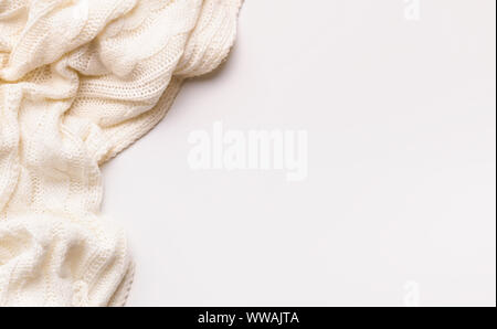 White autumn warm scarf on white background with copy space Stock Photo