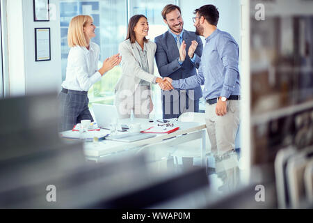 Teamwork - successfully completed business meeting Stock Photo - Alamy