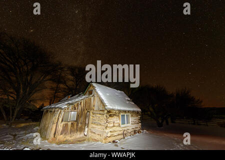 Night Sky With Old Cabin Lit By Flashlight Torrey Utah Usa