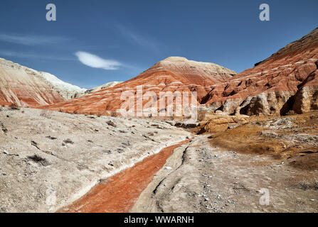 Landscape of Bizarre layered red and white mountains in beautiful desert park Stock Photo