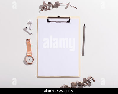 Clipboard with blank sheet of paper on background Stock Photo