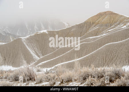 Fresh snow on eroded buttes, Caineville, Utah, USA Stock Photo