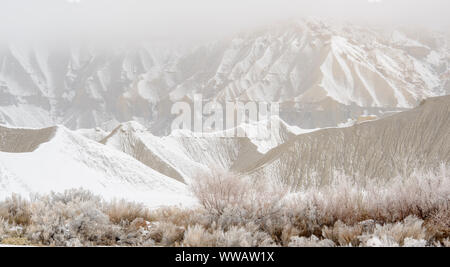 Fresh snow on eroded buttes, Caineville, Utah, USA Stock Photo