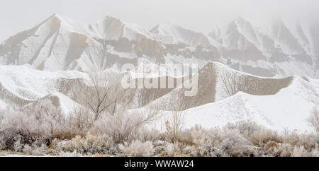 Fresh snow on eroded buttes, Caineville, Utah, USA Stock Photo