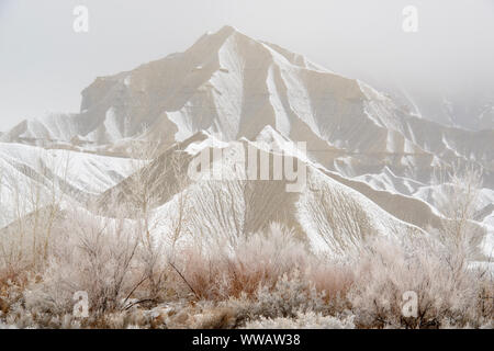 Fresh snow on eroded buttes, Caineville, Utah, USA Stock Photo