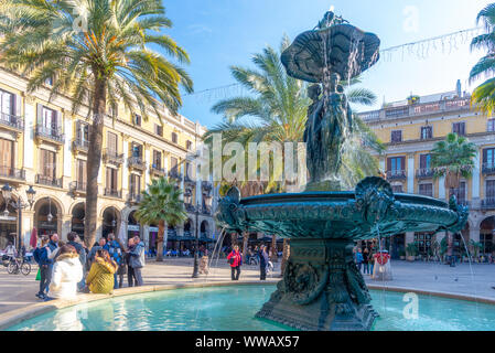 Barcelona, Spain - Jan 6, 2017: A fountain on the Plaza real of the Barrio Gotico, taken at the end of a sunny winter day Stock Photo