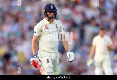 England’s Chris Woakes walks off after being dismissed during day three of the fifth test match at The Kia Oval, London. Stock Photo
