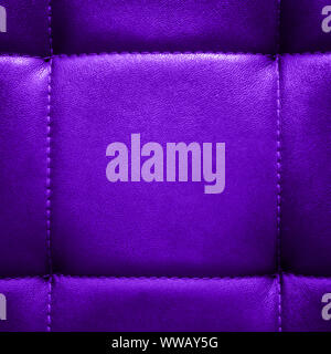 Shiny dark purple artificial textured leather stitched with thread. Close-up of sofa surface. View from directly above. Highly detailed square backgro Stock Photo