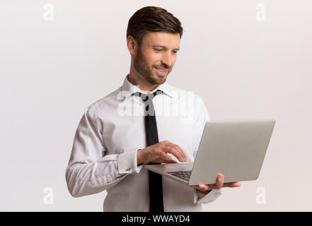 Businessman Working On Laptop Over White Background Stock Photo