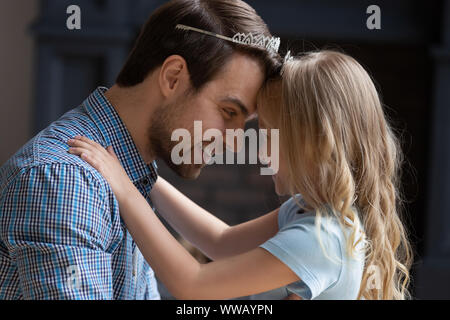 Head shot portrait overjoyed young dad playing with daughter. Stock Photo