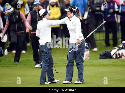 Team USA's Brittany Altomare (left) and Annie Park embrace on the 18th after winning the Fourball match on day two of the 2019 Solheim Cup at Gleneagles Golf Club, Auchterarder. Stock Photo