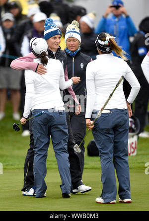 Team USA's Brittany Altomare (left) and Annie Park (left) console Team Europe's Anne Van Dam (second left) and Suzann Pettersen on the 18th after the Fourball match on day two of the 2019 Solheim Cup at Gleneagles Golf Club, Auchterarder. Stock Photo