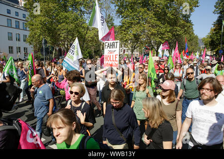 Frankfurt, Germany. 14th September 2019. Thousands of people march with banners and flags through Frankfurt city centre. Around 25.000 climate activists protested outside the 2019 Internationale Automobil-Ausstellung (IAA) against cars and for a better public transportation system and conditions for bicycles. 18.00 of them took part in a bicycle rally coming from several city in the wider Rhine-Main area to Frankfurt. Stock Photo
