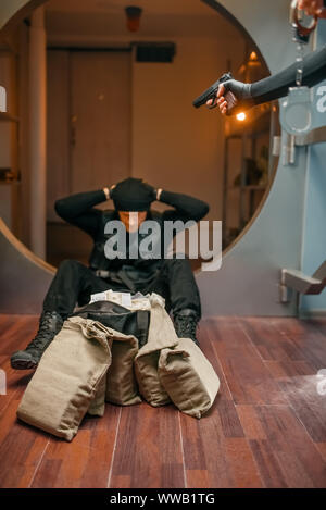 Two robbers in uniform could not divide the money Stock Photo