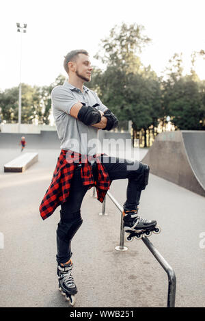 Roller skating, young skater poses in skate park Stock Photo