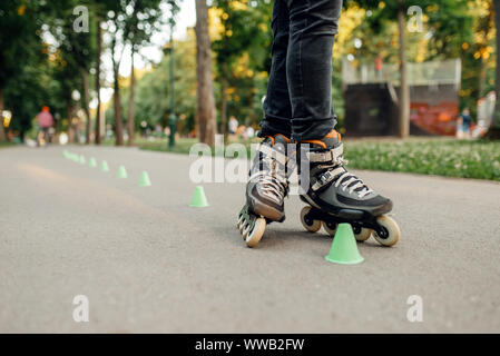 Roller skating, skater rolling around the cones Stock Photo