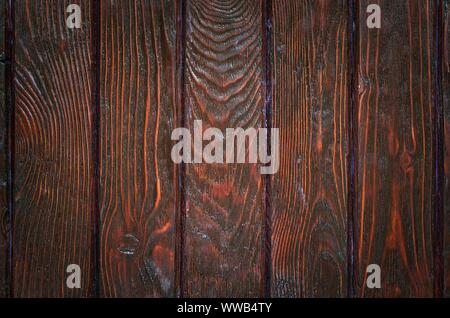 Wooden background texture. Creatively painted dark brown boards. Stock Photo