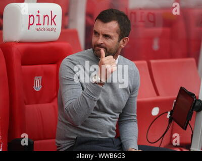 Stoke-On-Trent, Staffordshire, UK. 14th September, 2019. Stoke City manager Nathan Jones in the dugout ahead of the Championship fixture with Bristol City at the Bet365 Stadium. Stock Photo