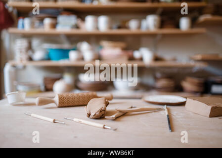 Plottery equipment on wooden table in workshop Stock Photo