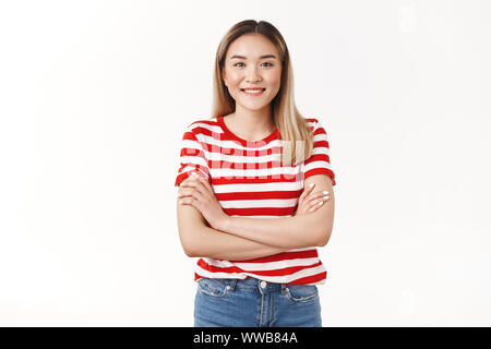 Studio shot pleasant friendly-looking young female asian student university cross arms chest professional confident pose smiling upbeat lucky mood Stock Photo