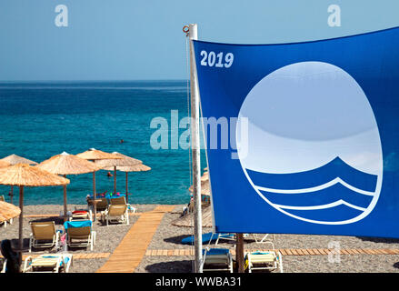 Blue flag at Kakkos bay beach, between Ferma and Koutsounari villages, Ierapetra, Lassithi, Greece. Stock Photo