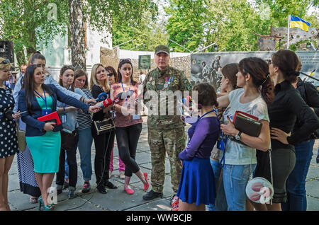 Dnipro, Ukraine - May 25, 2016: Interview is given by a tankman with the call sign “Gnome” (93 OMBr) Ivan Nachovny - the head of All-Ukrainian Union o Stock Photo