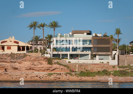 Orihuela Costa, Alicante, Spain - July, 2019: Big modern villa on front coast line Stock Photo
