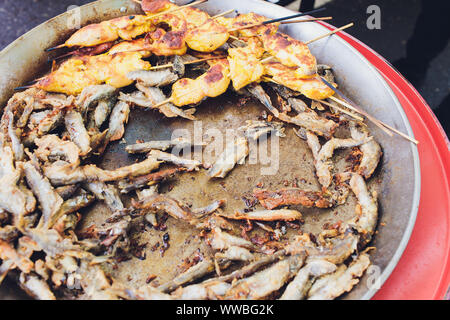 Paella seafood is cooked in a large capacity. Large Stock Photo