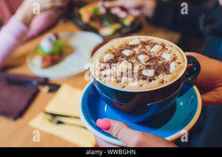 Mug of hot chocolate with marshmallows on table Stock Photo