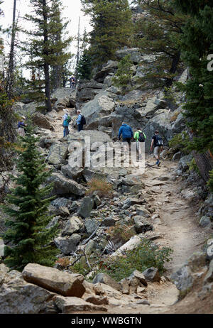 Hikers on the Cascade Canyon trail in Grand Teton National Park Stock Photo