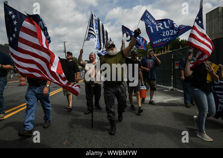 Dahlonega, Georgia, USA. 14th Sep, 2019. Trump supporters joined longtime white nationalist leader Chester Doles in what Doles billed as 'American Patriot Rally'' to honor President Trump in Dahlonega, Georgia on Saturday. All told, around 50 people joined Doles' rally, while around 100 people''”including members of the so-called 'Antifa'' movement''”turned out to protest the event, which drew hundreds of law enforcement officers from surrounding counties Credit: Miguel Juarez Lugo/ZUMA Wire/Alamy Live News Stock Photo