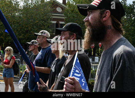 Dahlonega, Georgia, USA. 14th Sep, 2019. Trump supporters joined longtime white nationalist leader Chester Doles in what Doles billed as 'American Patriot Rally'' to honor President Trump in Dahlonega, Georgia on Saturday. All told, around 50 people joined Doles' rally, while around 100 people''”including members of the so-called 'Antifa'' movement''”turned out to protest the event, which drew hundreds of law enforcement officers from surrounding counties. Credit: Miguel Juarez Lugo/ZUMA Wire/Alamy Live News Stock Photo