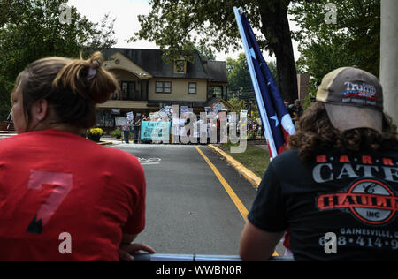 Dahlonega, Georgia, USA. 14th Sep, 2019. Trump supporters joined longtime white nationalist leader Chester Doles in what Doles billed as 'American Patriot Rally'' to honor President Trump in Dahlonega, Georgia on Saturday. All told, around 100 people joined Doles' rally, while around 200 people''”including members of the so-called 'Antifa'' movement''”turned out to protest the event, which drew hundreds of law enforcement officers from surrounding counties. Credit: Miguel Juarez Lugo/ZUMA Wire/Alamy Live News Stock Photo