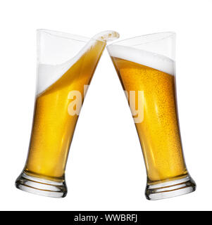 two glasses of beer toasting and creating splash isolated on white background Stock Photo
