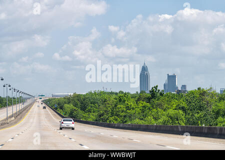 Multiple lane interstate highway i-165 with view on road cars with skyline cityscape view on Mobile, Alabama Stock Photo