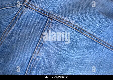 Blue worn denim texture detail close up. Stock Photo
